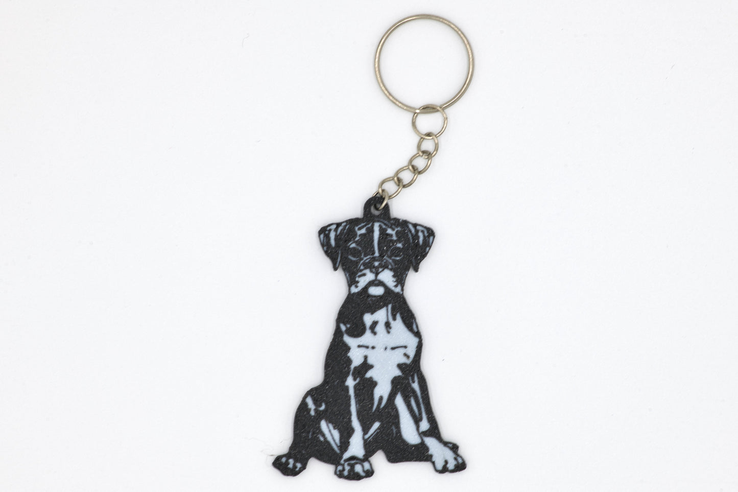 Keychain with a black and white Boxer silhouette dog design on a white background