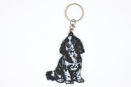 Keychain with a black and white Cocker Spaniel silhouette dog design on a white background