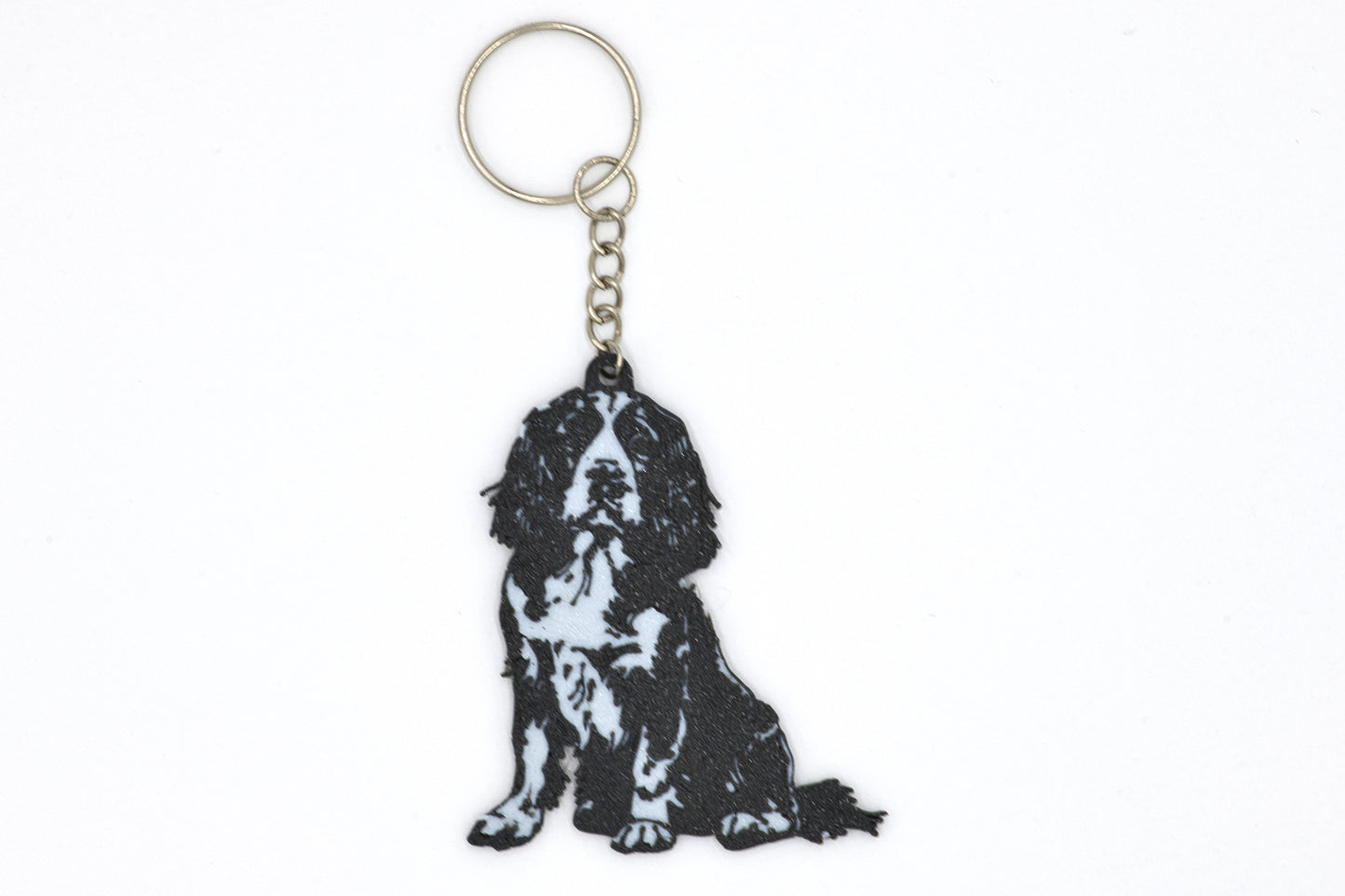Keychain with a black and white English Springer Spaniel silhouette dog design on a white background